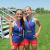Nonnewaug’s Gianna Lodice, left, and Sammi Faull played huge roles in the Chiefs’ girls team win in Saturday’s Berkshire League Track and Field Championship Meet at Plum Hill Sports Complex in Litchfield.