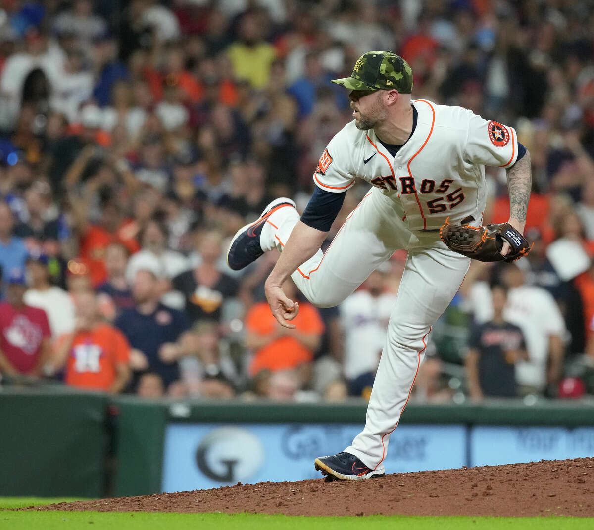 Houston Astros relief pitcher Ryan Pressly (55) strikes out Texas Rangers Sam Huff (55) to end the ninth inning of an MLB game at Minute Maid Park on Saturday, May 21, 2022 in Houston. Astros won 2-1.