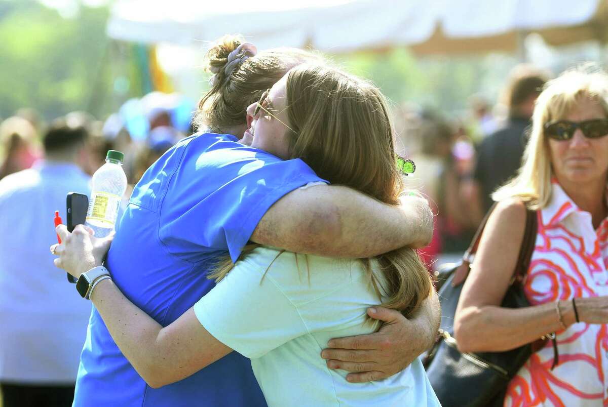 Family and friends gather for Summer Fawcett, the 7-year-old Norwalk resident who died in a house fire last week, at a community celebration in her honor at Taylor Farm Dog Park in Norwalk, Conn. on Saturday, May 21, 2022.
