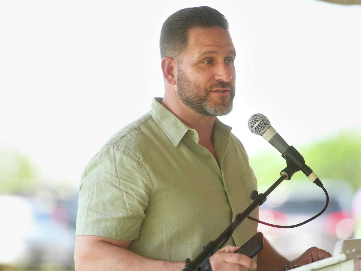 Northeast Community Church Pastor Thomas Mahoney leads a community celebration in honor of Summer Fawcett, the 7-year-old Norwalk resident who died in a house fire last week, at Taylor Farm Dog Park in Norwalk, Conn. on Saturday, May 21, 2022.