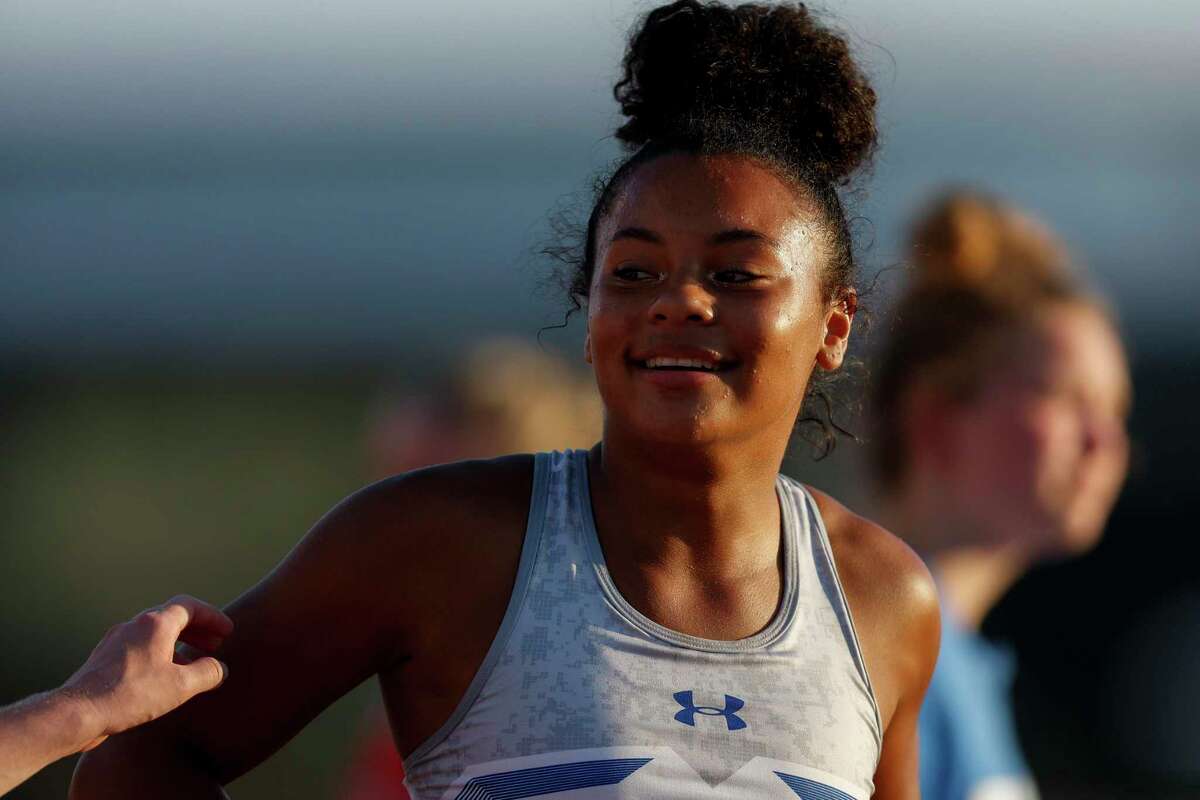 University City Randolph’s Taylor Nunez reacts as she is congratulated on her Class 3A 100 Meter Dash win during the UIL State Track and Field Championships at Mike A. Myers Stadium in Austin, Texas, Thursday, May 12, 2022. She finished with a time of 11.59.