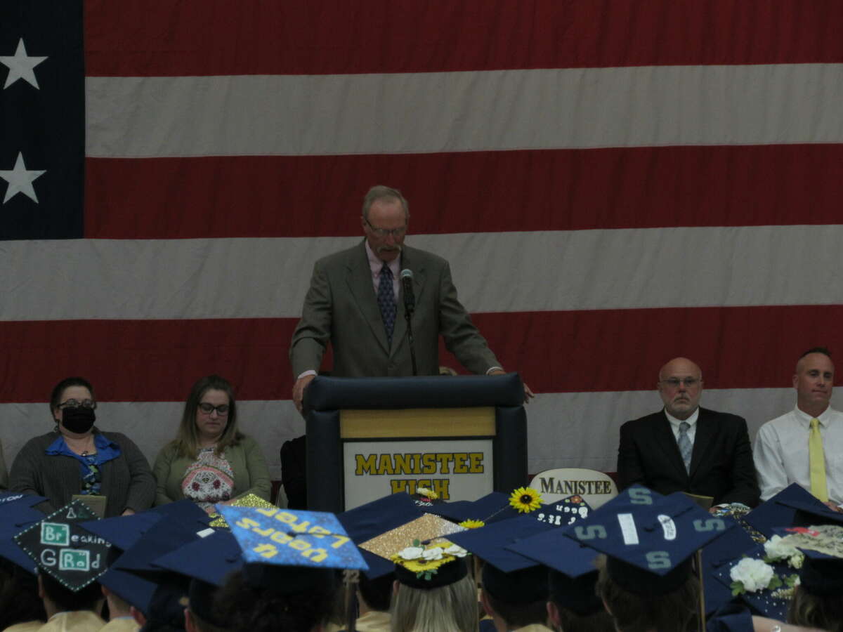 Manistee Area Public Schools principal, Andy Huber, speaks to graduating seniors and their families at a commencement ceremony on Saturday.