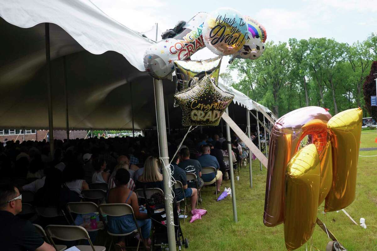 Balloons that are gifts for Maria College graduates are seen tied to a tent pole during the college's commencement on Sunday, May 22, 2022, in Albany, N.Y. This was the first full, in-person commencement ceremony that the College has held since 2019. Over 190 students graduated with degrees in nursing, health and occupational sciences, and liberal arts. Students who earned a certificate in Bereavement and Practical Nurse programs also participated in the commencement. (Paul Buckowski/Times Union)