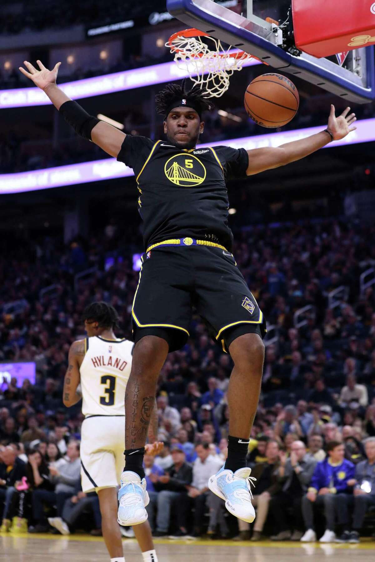 Golden State Warriors’ Kevon Looney dunks against Denver Nuggets in 2nd quarter during Game 5 of NBA Western Conference First Round playoff game at Chase Center in San Francisco, Calif, on Wednesday, April 27, 2022.
