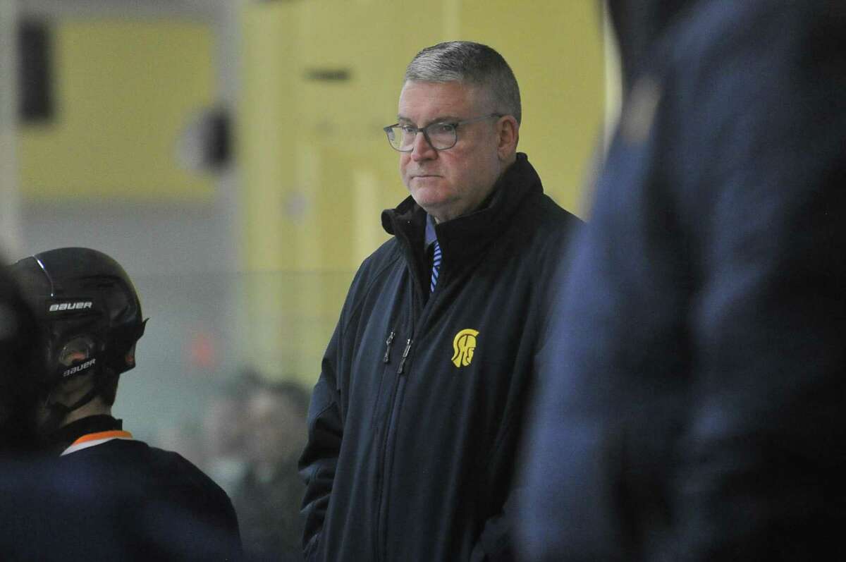 Head Coach Chris Day of the Simsbury Trojans watches the action during a game against the Notre Dame Fairfield Lancers on Wednesday January 16, 2019 at The Rinks in Shelton, Connecticut.