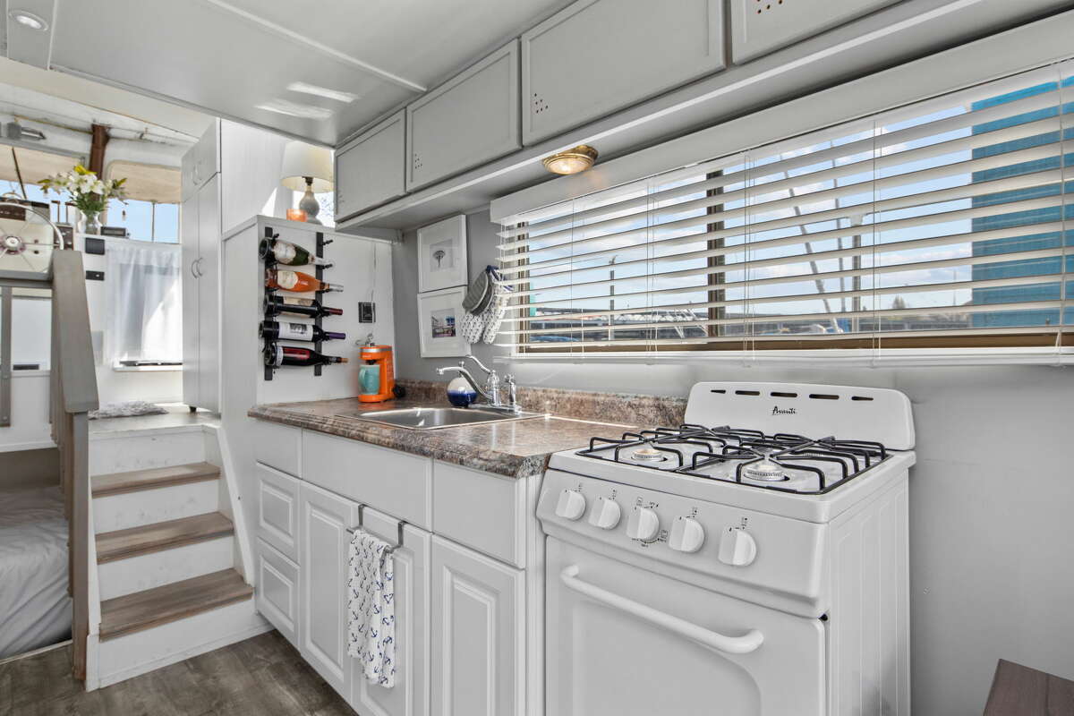 The kitchen is fully equipped and is one level below the bedroom.
