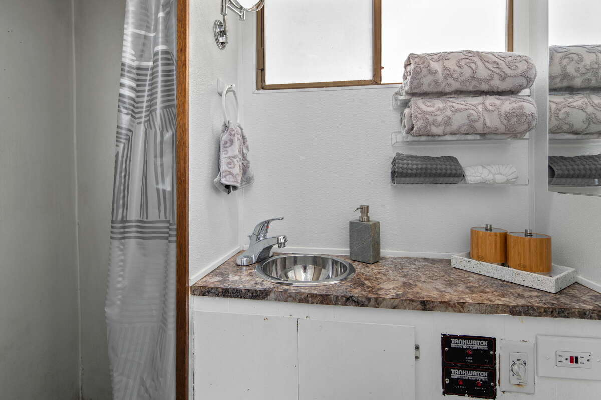 The bathroom includes a walk-in shower.