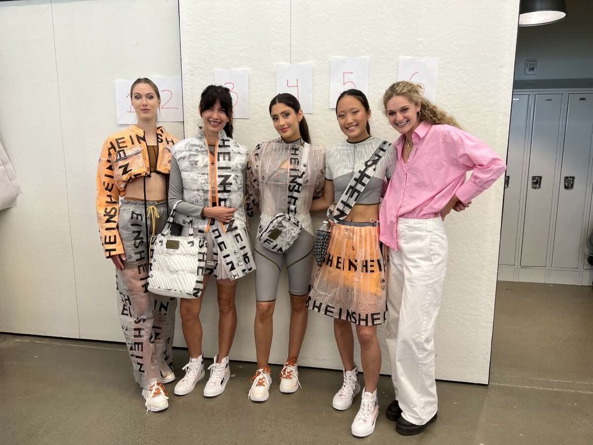Ava Grand, right, with runway models sporting her designs. Her behind-the-scenes looks at transforming Shein fast-fashion packaging waste into clothing went viral on TikTok.