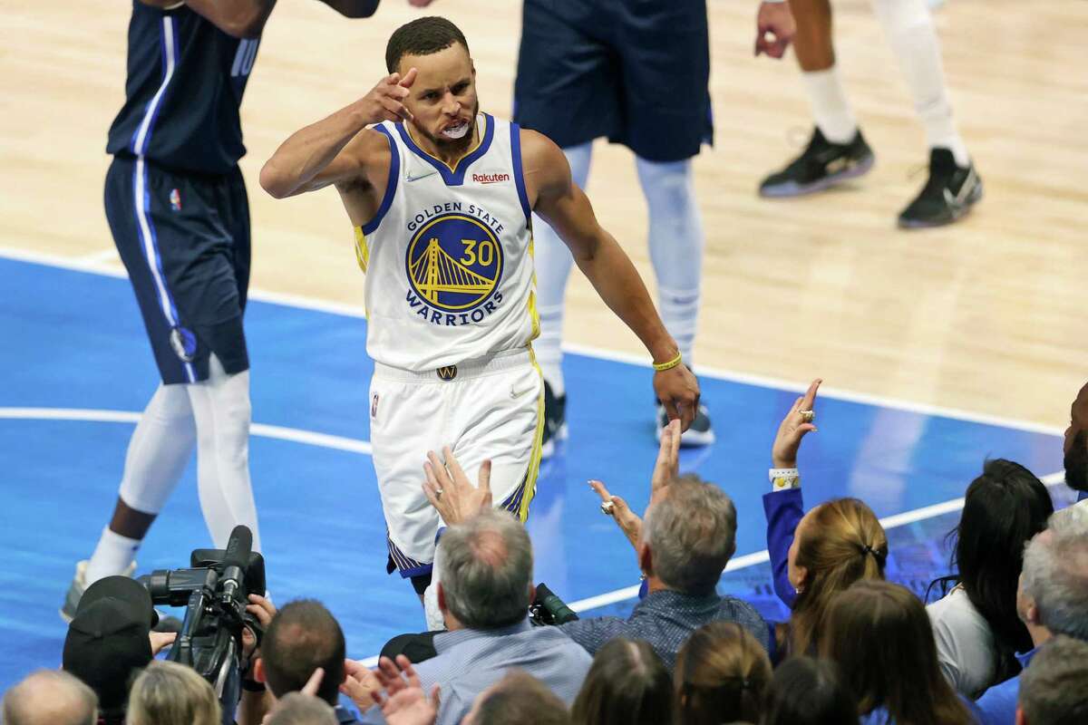 Golden State Warriors’ Stephen Curry celebrates a basket and a Dallas Mavericks’ foul in 1st quarter during Game 3 of NBA Western Conference Finals at American Airlines Center in Dallas, Texas, on Sunday, May 22, 2022.