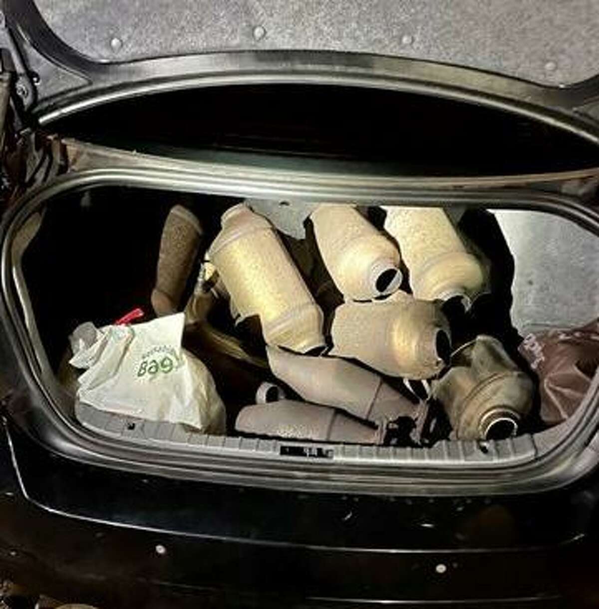 Norwalk police said officers recovered 13 catalytic converters in the trunk of a car that appeared to have been recently cut from vehicles earlier this year.