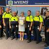 First Selectwoman Jennifer Tooker presents the Emergency Medical Services Week proclamation to Police Chief Foti Koskinas, EMS Crew Chief Larry Kleinman, EMS Crew Chief Rick Baumblatt, EMS Deputy Director Marc Hartog, EMS Crew Chief Eric Hebert and Deputy Chief and EMS Director Sam Arciola.