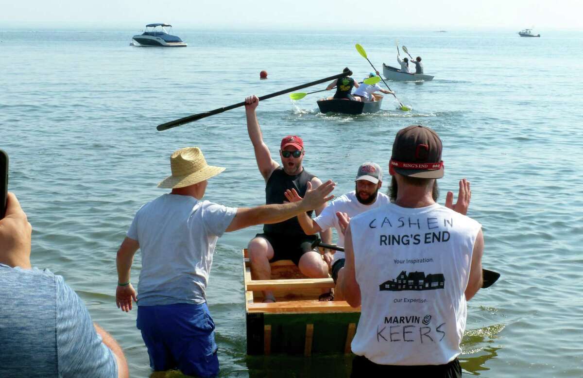 “The Ringy Dinghy" in the "build your own boat" relay race during the 6th year of Showdown on the Sound at Weed Beach in Darien, Conn., on Saturday. Showdown on the Sound is an annual fundraising event to honor life of Darien native, Michael Taylor, who died from opioid addiction.