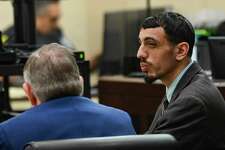 Eduardo Torres, right, speaks with his lawyer, John Economidy, at his capital murder trial last week. He is accused, along with his brother, Leonard Torres, of robbing and shooting Nathan Valdes, 21, on South Presa Street on Oct. 24, 2016.