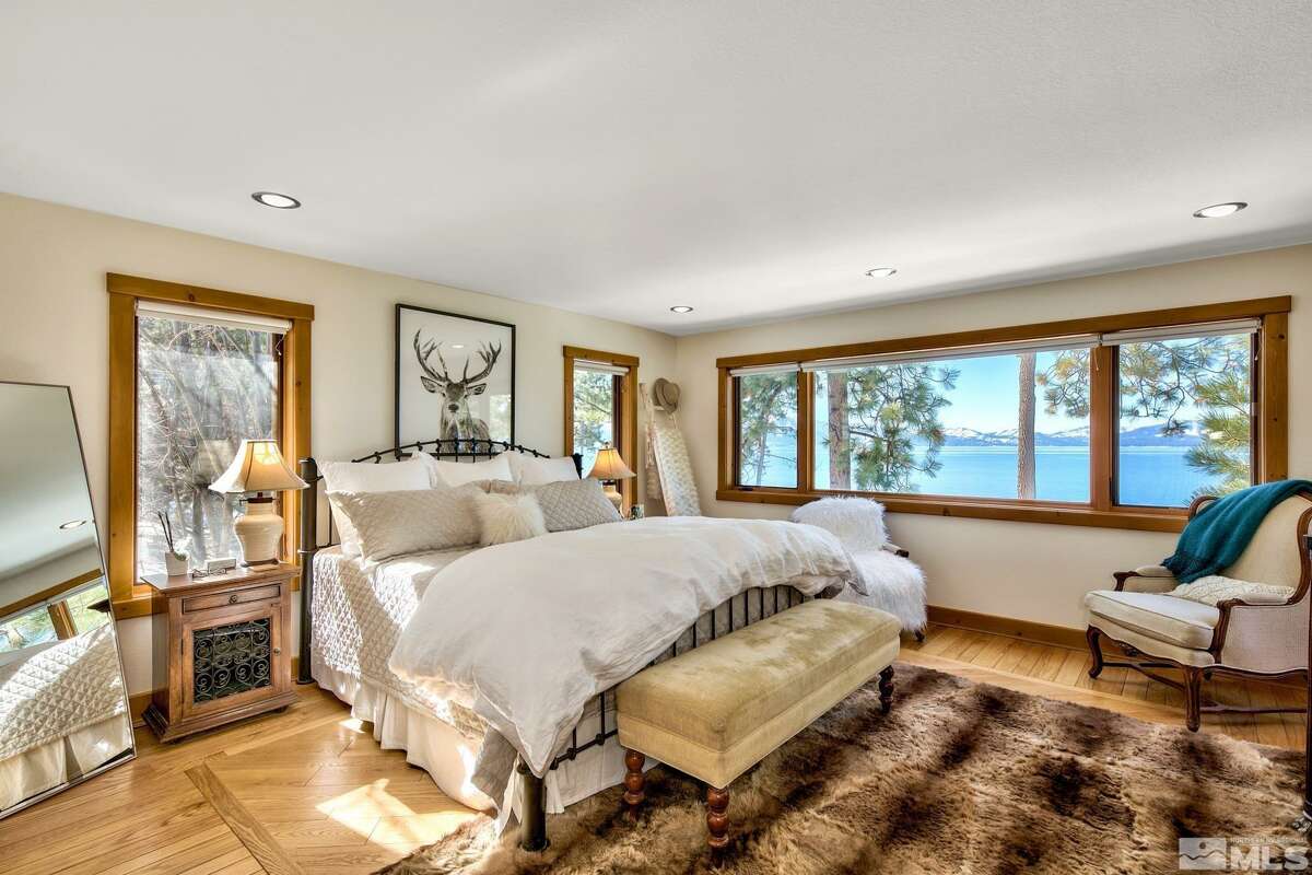 The home's bedrooms have beautiful lake views.