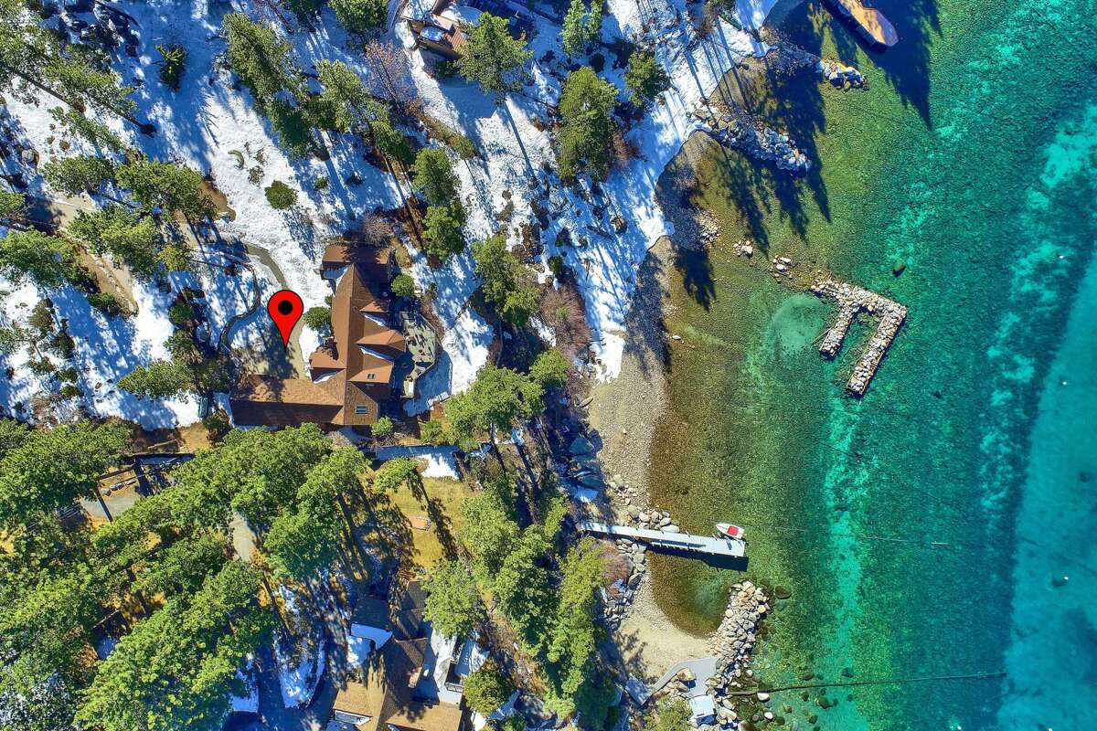 The drone's eye view shows us the lakeshore and how close the home is to the water.