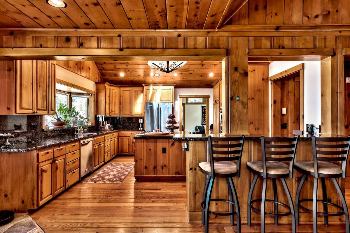 The kitchen is outfitted for modern cooking, though it too feels original.