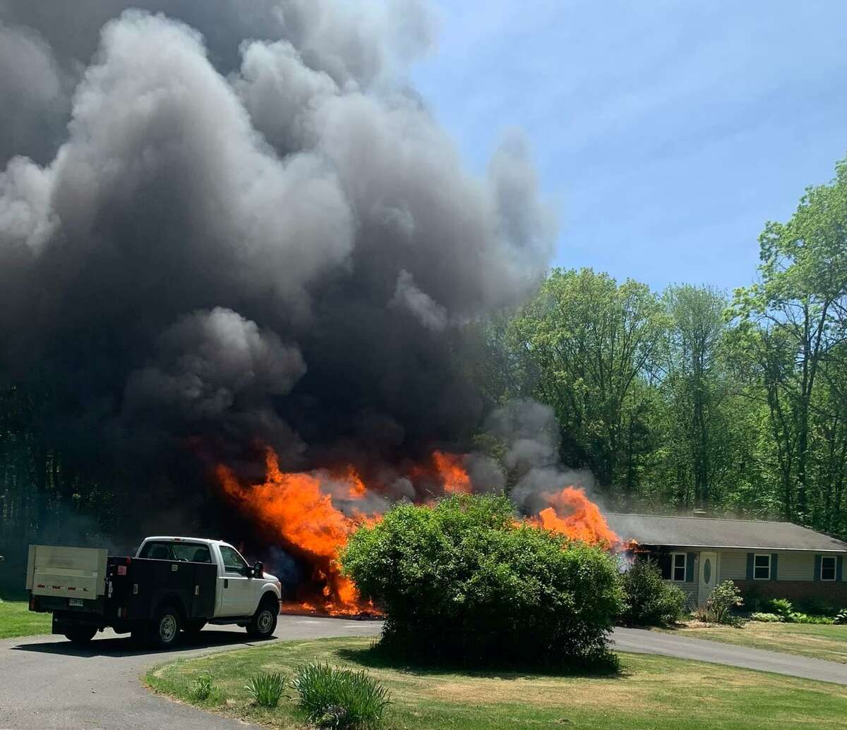 A person was sent to the hospital after a garage fire raged on a Killingly home Monday.