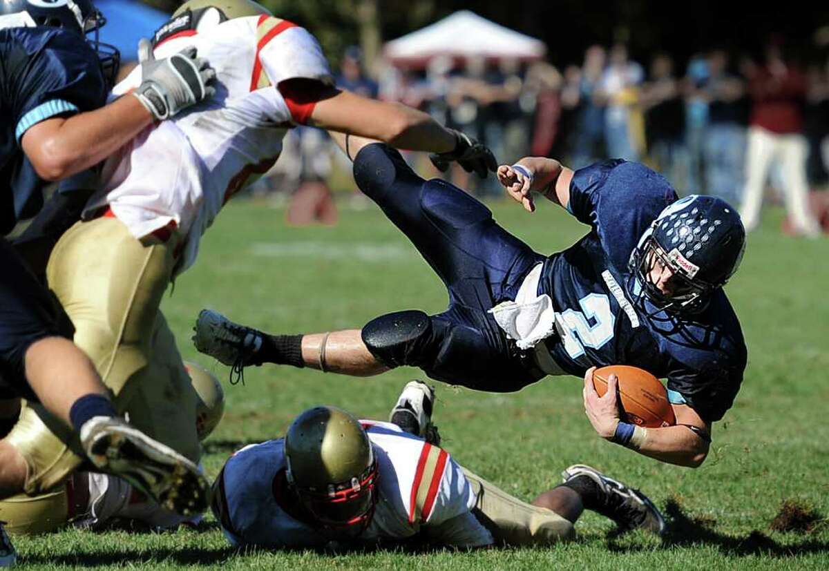 Oxford's Nick Donofrio throws himself over a fallen Stratford player during their game Saturday Oct. 2, 2010 at Oxford High School.