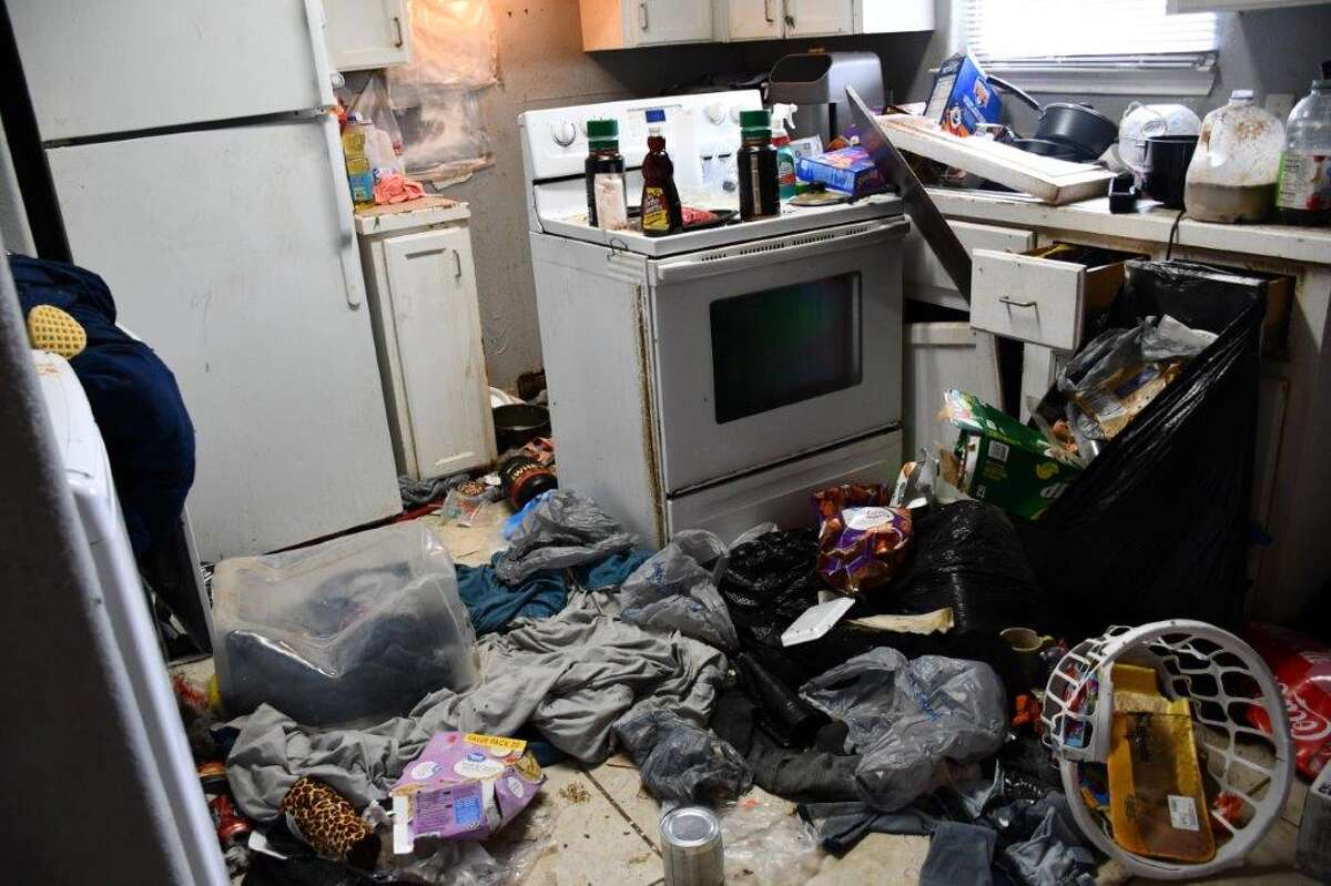 The kitchen was littered with trash.