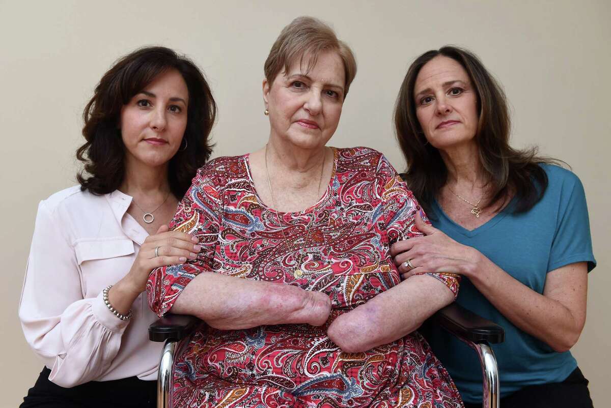 Carol Proto, center, is photographed with her daughters, Maria DeMattie, left, and Alicia Richitelli at her home in Wallingford on May 13, 2022.