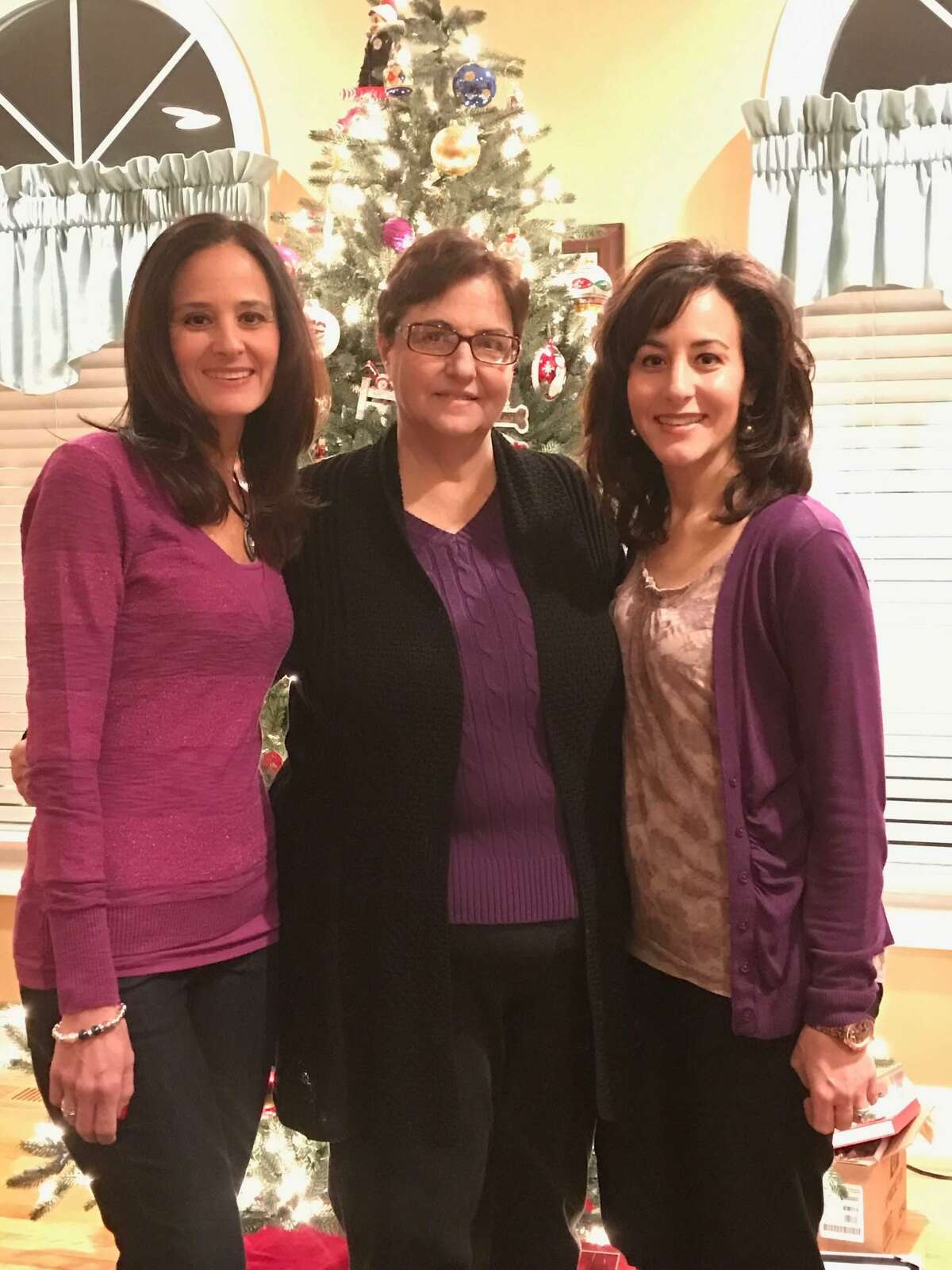 Carol Proto, center, with her daughters, Alicia Richitelli, left, and Maria DeMattie, in happier times.