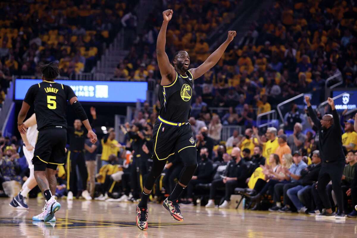 Golden State Warriors’ Draymond Green reacts after a basket against Dallas Mavericks in 1st quarter of Game 1 of NBA Western Conference Finals at Chase Center in San Francisco, Calif., on Wednesday, May 18, 2022.
