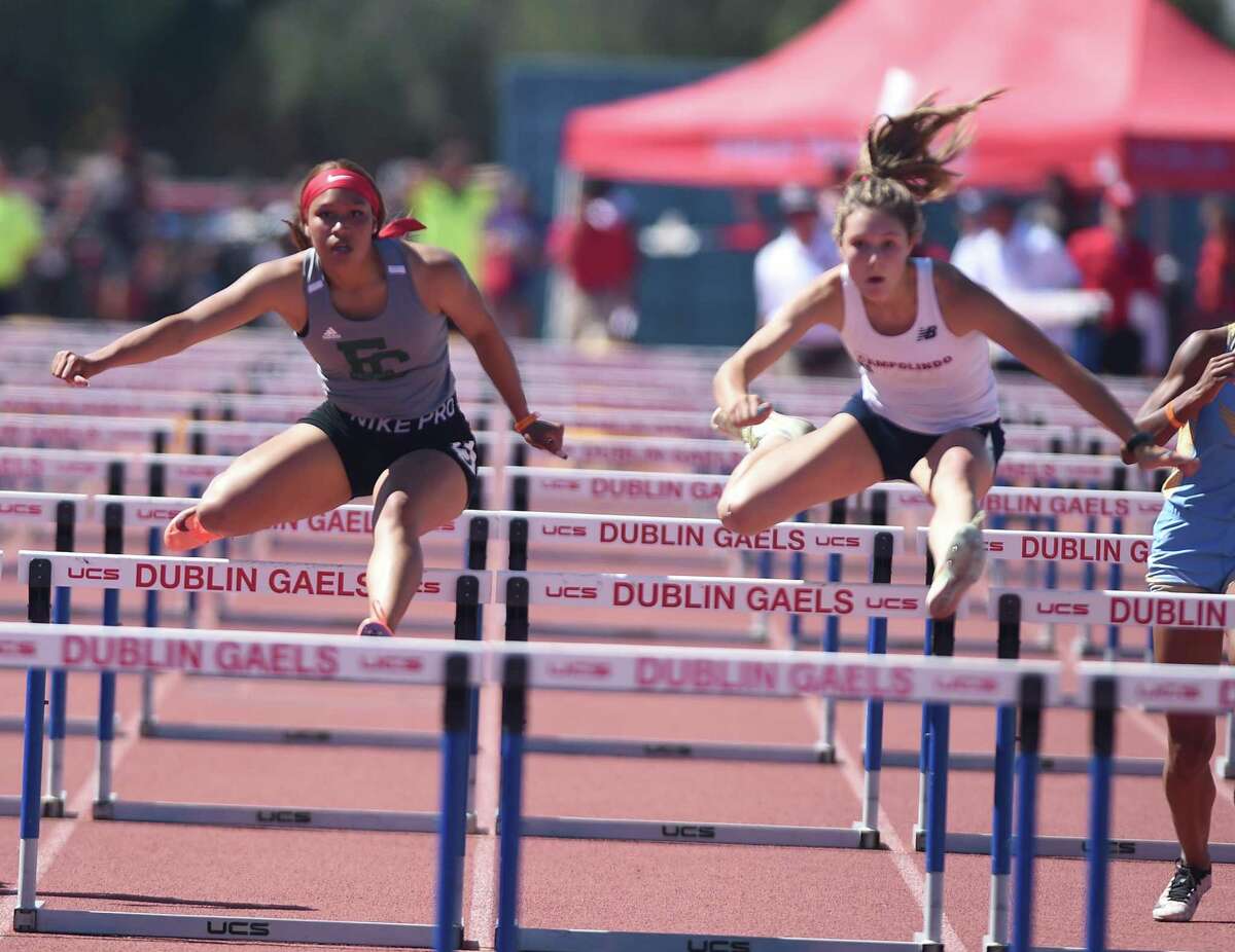 Campolindo's Mari Testa, right, edged El Cerrito's Ruffin Saqqara in the 100 hurdles at the North Coast Section Meet of Champions, one of three wins Testa had a hand in for the Cougars.