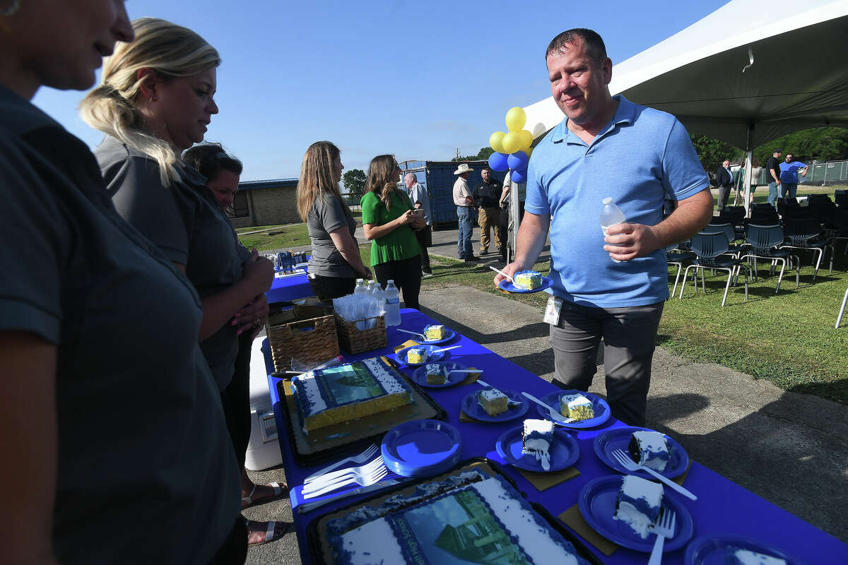 Principal Paul Shipman stops for cake following a groundbreaking ceremony was held at Hamshire-Fannett High School Monday. Photo made Monday, May 23, 2022. Kim Brent/The Enterprise