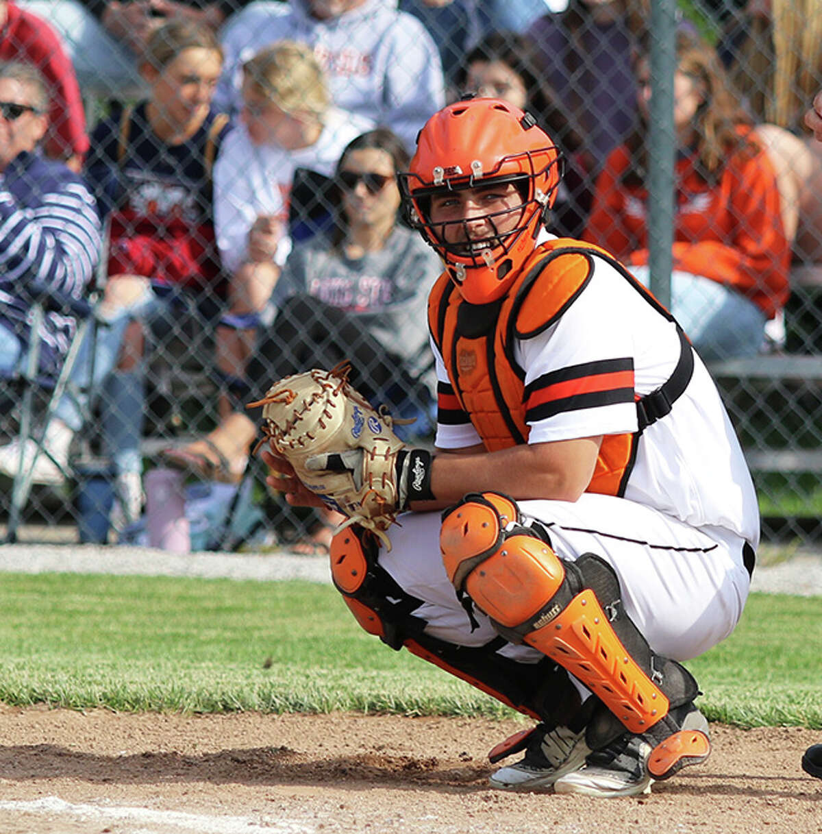 Gillespie senior catcher Gavin Griffith looks to the dugout for a sign in Monday's Class 2A regional title game against New Berlin in Gillespie. Griffith's walk-off RBI single in the seventh inning gave the Miners a win and a trip to this week's Pleasant Plains Sectional.