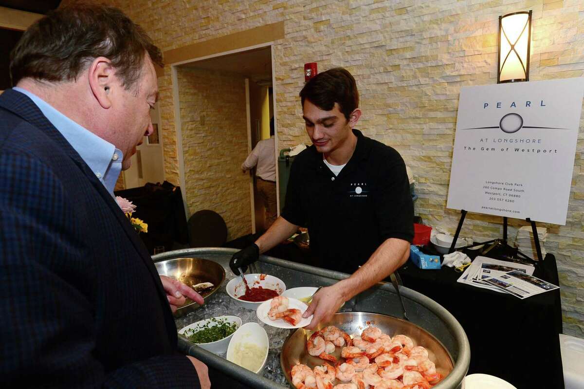 Staff from the Pearl at Longshore serve Raw Bar classics during The 15th annual Taste of Westport Thursday, May 9, 2019,at the Westport Inn in Westport, Conn. The event showcased the best of the local restaurant scene with experts in both classic comforts and gastronomic innovations. The charity event benfitted CLASP, whose mission is to provide homes and opportunities for people with autism and developmental disabilities.