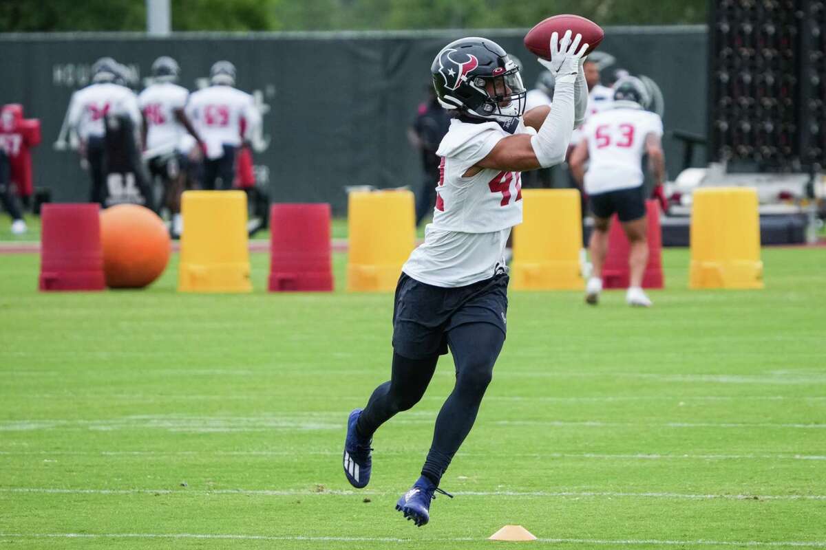 Houston Texans defensive back Jalen Pitre leaps to make a catch during OTAs Tuesday, May 24, 2022, at Houston Methodist Training Center in Houston.