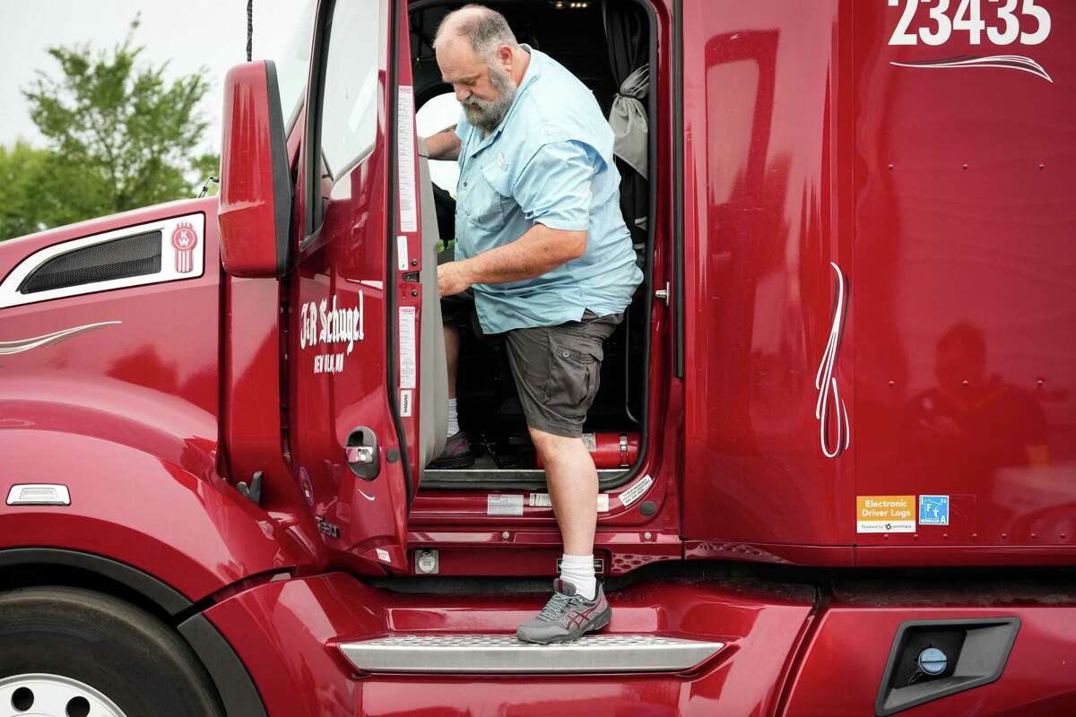 John Barnes runs through his pre-trip check before starting his day as a long-haul truck driver Tuesday, May 24, 2022, at a truck yard in Pasadena. Barnes is a former police officer who was injured in 2018 during a mass shooting at Santa Fe High School.