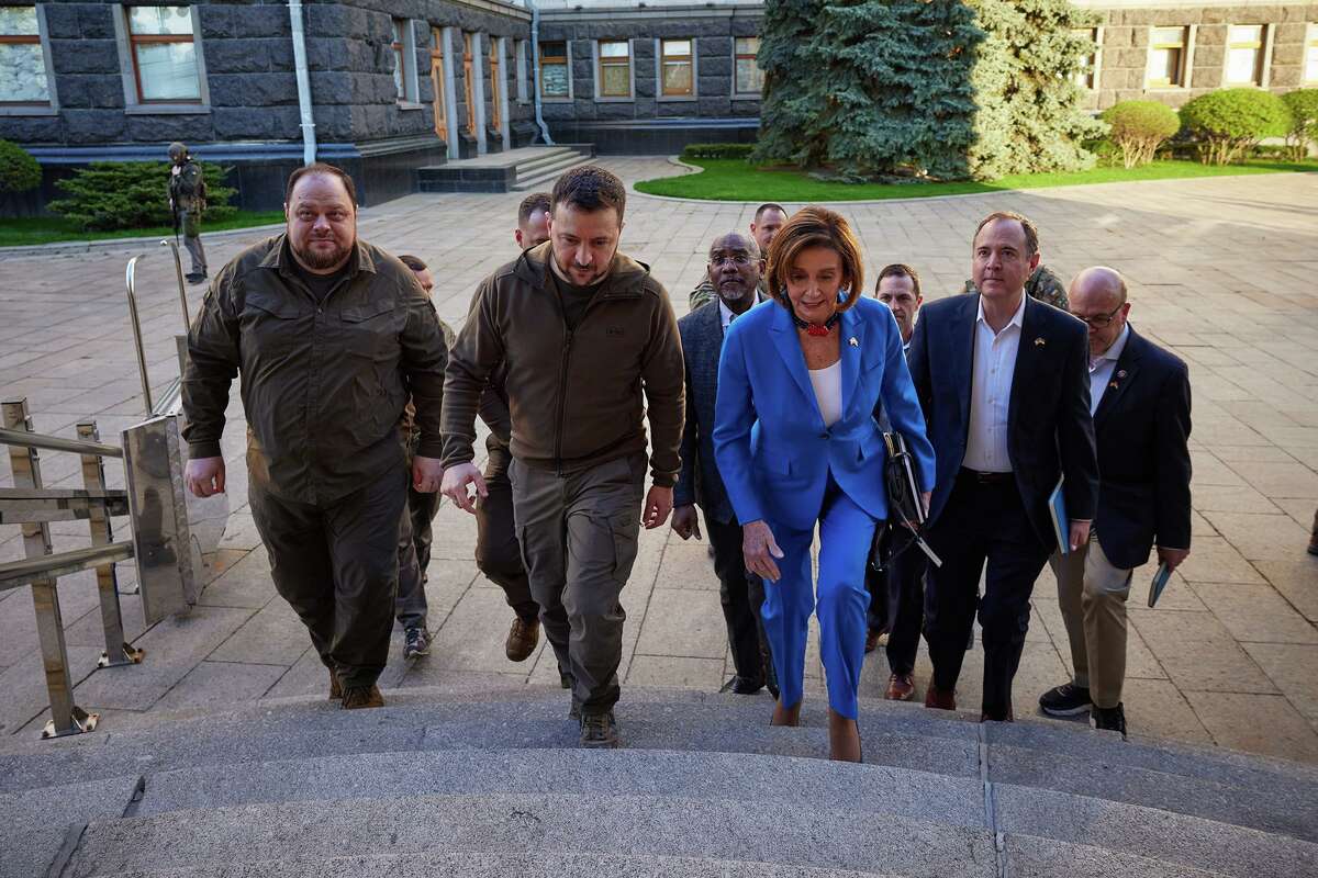 U.S. House Speaker Nancy Pelosi, D-Calif., walks with Ukrainian President Volodymyr Zelenskyy, center, as she arrives with a congressional delegation at the Mariyinsky palace in Kyiv, Ukraine, on May 1, less than three weeks before Congress approved a $40 billion aid package for Ukraine.