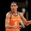 Connecticut Sun guard Jasmine Thomas (5) look to pass against the New York Liberty in the second half during a WNBA basketball game, Saturday, May 7, 2022, in New York. The Liberty won 81-79. (AP Photo/Adam Hunger)
