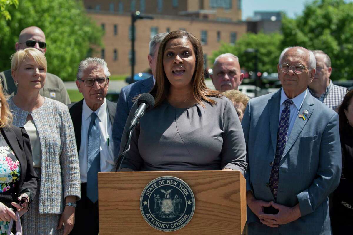 New York Attorney General Letitia James, surrounded by elected officials and some of the St. Clare's Hospital pensioners, speaks at a press conference on Tuesday, May 24, 2022, in Schenectady, N.Y. Attorney General James announced that her office is filing a lawsuit against the Roman Catholic Diocese of Albany and some of its top officials over the alleged mismanagement of a depleted pension fund that wiped out retirement plans for more than 1,100 former employees of the now-closed St. Clare's Hospital. (Paul Buckowski/Times Union)