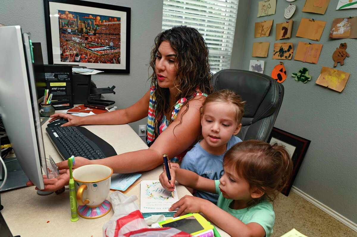 Jolene Guerra, who has developed an app called Breastaurant to connect parents in need of baby formula, sits with her children, Jocelyn Hortencia Garcia, 2, front, and Gweneviere Ruth Garcia, 4, on Monday, May 23, 2022.