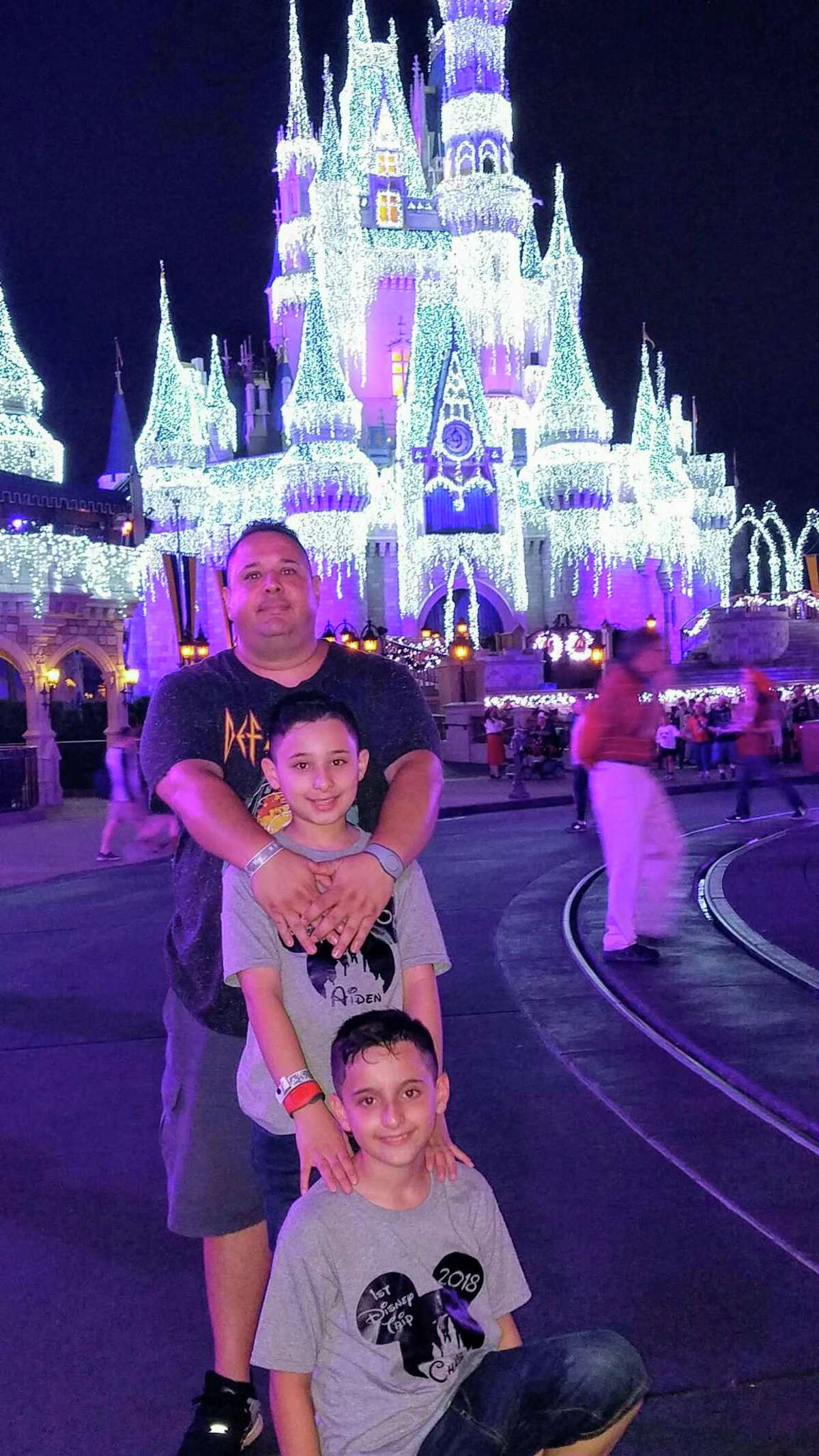 Danny Quaranta poses with his twin sons at Disney World while on vacation. Quaranta died in his sleep on May 14.