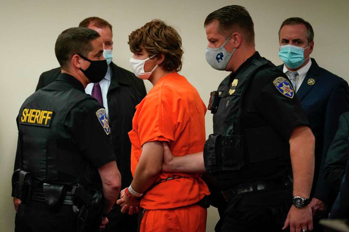 Payton Gendron is led out of the courtroom after a hearing at Erie County Court, in Buffalo, N.Y., Thursday, May 19, 2022. Gendron faces charges in the May 14, fatal shooting at a supermarket.
