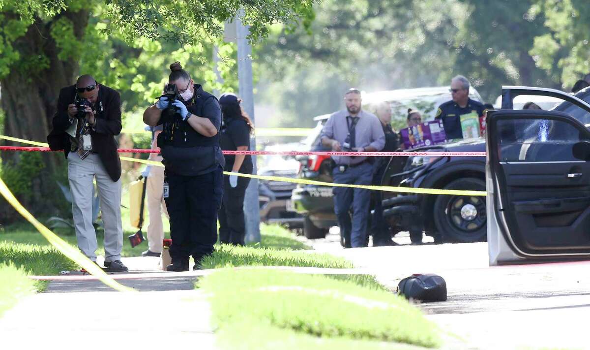 Houston Police investigate a fatal officer-involved shooting on Josie Street in Houston, on Wednesday, April 27, 2022. Jalen Randle was shot April 27 as he exited a vehicle. Police were trying to arrest the suspect, who had multiple felony warrants. (Elizabeth Conley/Houston Chronicle via AP)