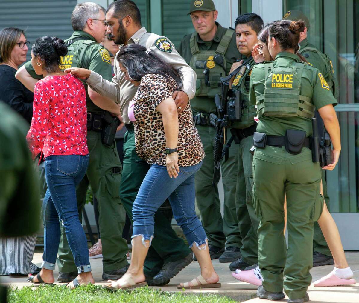People leave the Uvalde Civic Center Tuesday, May 24, 2022. At least 14 students and 1 teacher were killed when a gunman opened fire at Robb Elementary School in Uvalde according to Texas Gov. Greg Abbott. Students from the school were evacuated to the civic center.