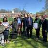 Riverside School celebrated Arbor Day with a tree-planting ceremony on its back field on April 29. From left are students Japser Davis, Sienna Chodos and Vijeesh Nathan; town Tree Warden Greg Kramer; Jake Pollak, a tree climber for the town; Principal Christopher Weiss; JoAnn Messina, executive director of the Greenwich Tree Conservancy; and First Selectman Fred Camillo.