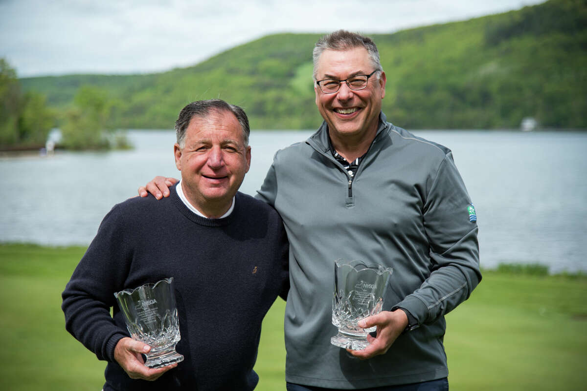 Bob Rosen of Buffalo, left, and Matt Clarke of Loudonville hold the championship hardware Monday, May 23, 2022, after winning the New York State Golf Association's Four Ball Championship at the Leatherstocking Golf Club in Cooperstown.