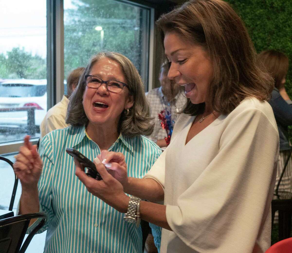 Dianne Anderson looks over early voting results for the Precinct 4 County Commissioner seat with her daughter Valerie Schmidt 05/24/2022 during a watch party for election results at Tall City Brewing Company. Tim Fischer/Reporter-Telegram