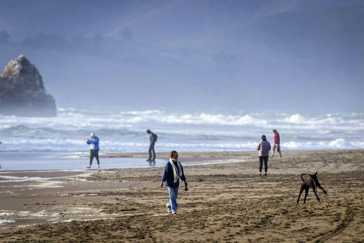 Beachgoers take advantage of the late afternoon sun at Ocean Beach in San Francisco, Calif., on Monday, March 28, 2022.