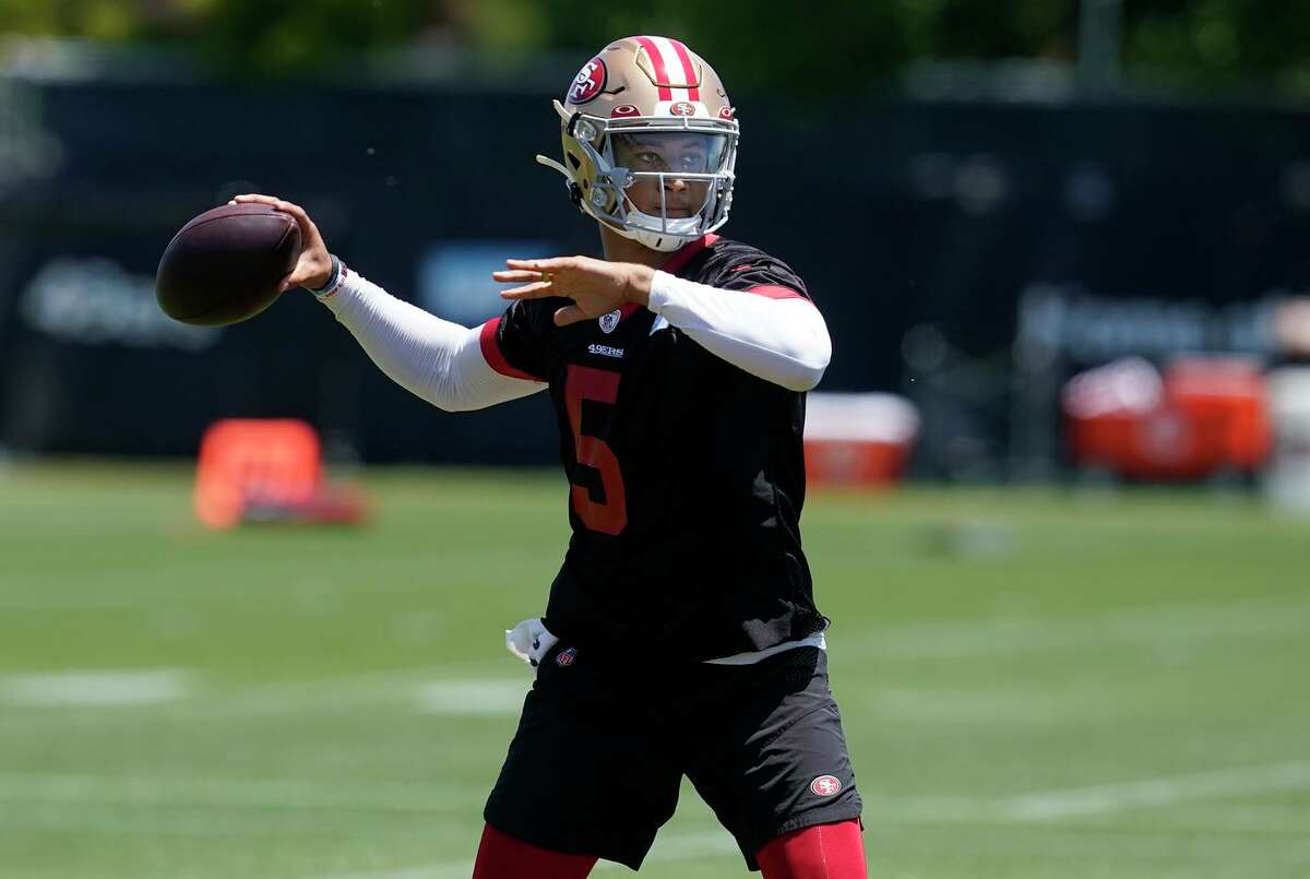 49ers quarterback Trey Lance takes part in drills at the team’s practice facility in Santa Clara. Lance has demonstrated more assertiveness as he prepares for his second NFL season.