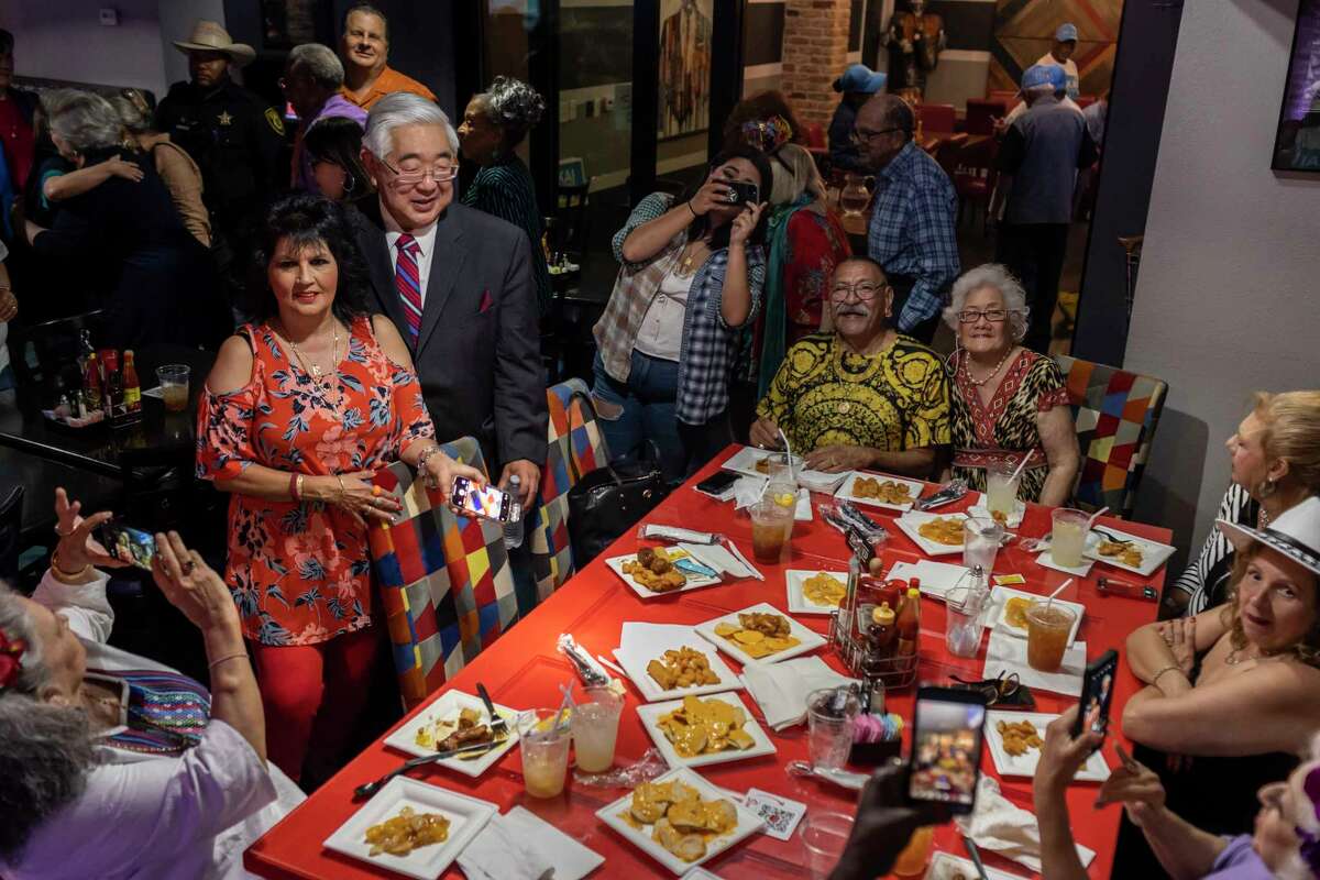Bexar County Judge Democratic candidate and former District Judge Peter Sakai poses for photos with supporters during his campaign watch party at Tony G's Soul Food in San Antonio, Texas, on May 24, 2022.