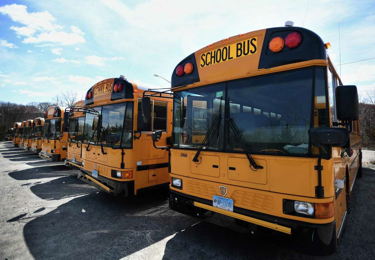 School buses are parked in neat rows at the Trumbull school bus depot at 81 Spring Hill Road in Trumbull, Conn. on Wednesday, April 1, 2020. Schools across the state are offering more counseling services and resources, as well as having increased police presences, in the wake of a shooting in Uvalde, Texas that left at least 18 children dead Tuesday.