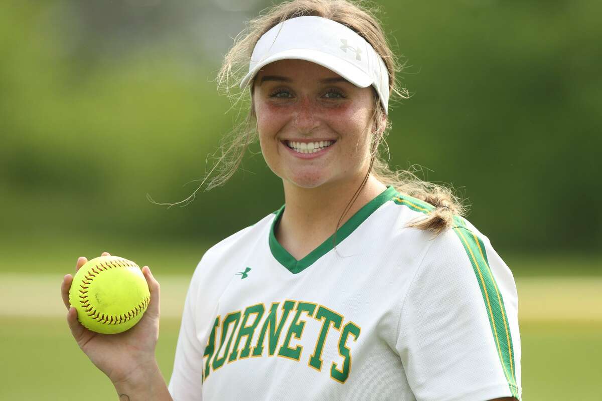 Brown County's Cortni Law holds the ball she hit for her 100th career hit on Friday against Barry Western.