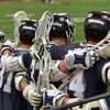 Wilton players stand arm in arm in final seconds during FCIAC boys lacrosse semifinal action against Staples at Brien McMahon High School Norwalk, Conn., on Tuesday May 24, 2022. Wilton beat Staples 7-6.