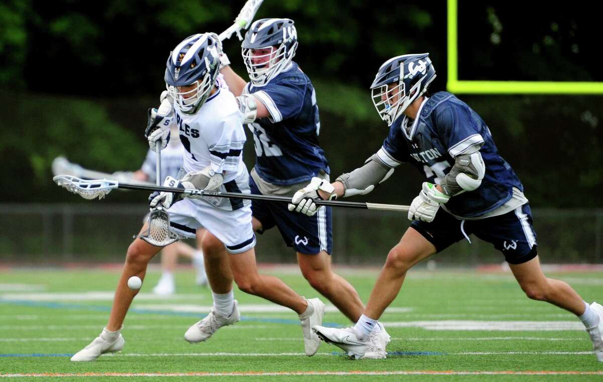 Wilton's Nathaniel Rath, right, tries to prevent a recovery of the ball by Staples' Gavin Rothenberg during FCIAC boys lacrosse semifinal action at Brien McMahon High School Norwalk, Conn., on Tuesday May 24, 2022. Wilton went on to beat Staples 7-6.